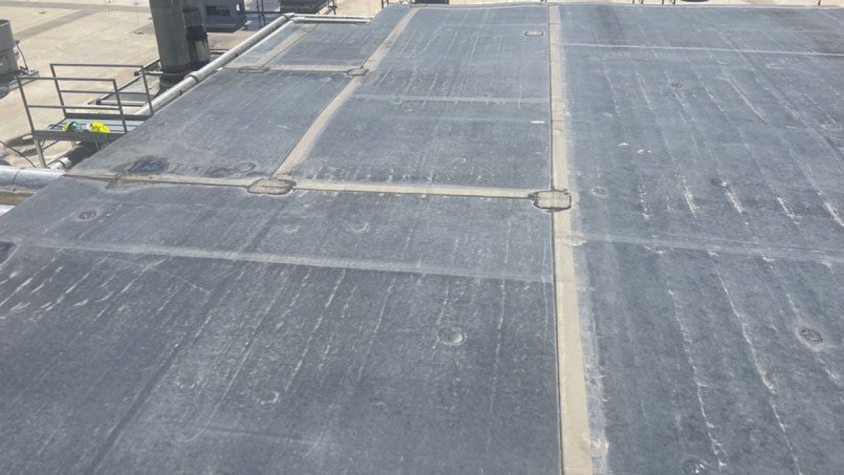 EPDM Roof inspection by Custom Exteriors in Northern Colorado