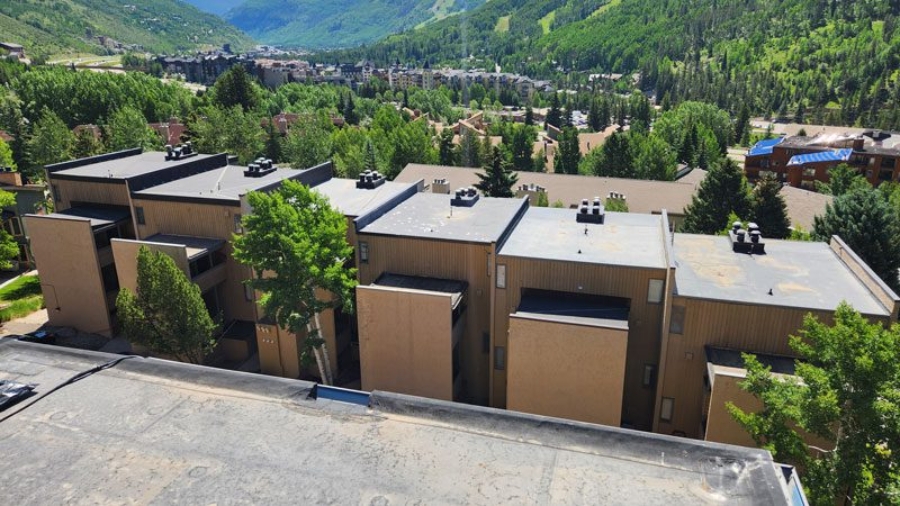 Flat roofs on a Colorado multi-family property recently inspected by Custom Exteriors, a multi-family roofing company