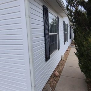 White vinyl siding replacement by Custom Exteriors