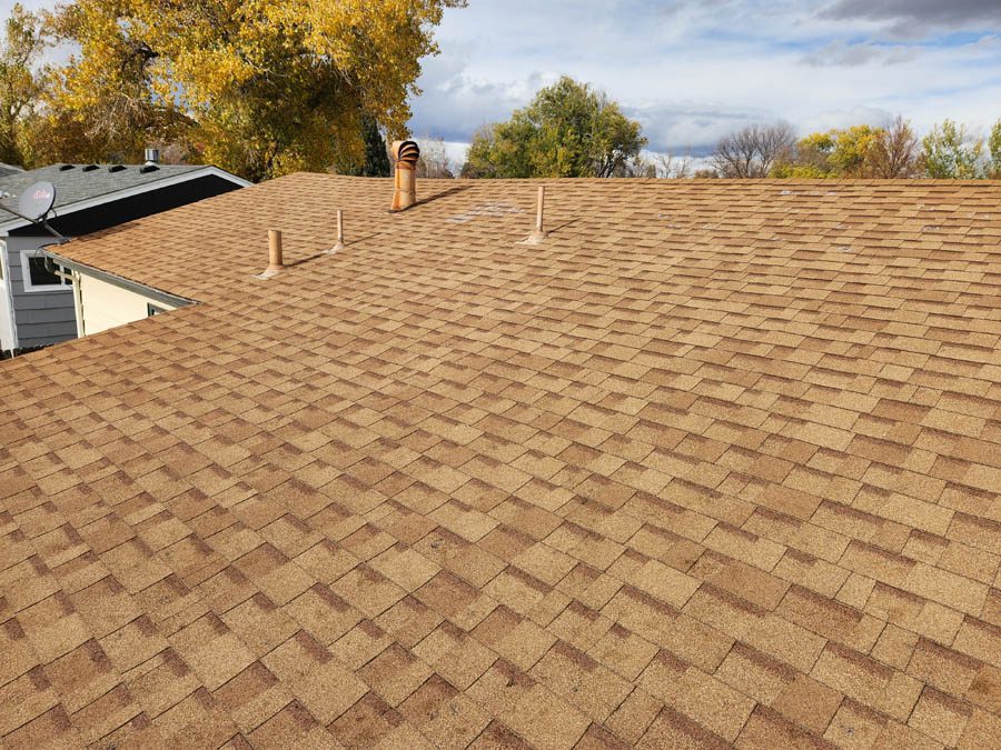 Residential roof replacement by Custom Exteriors, a Longmont roofing company