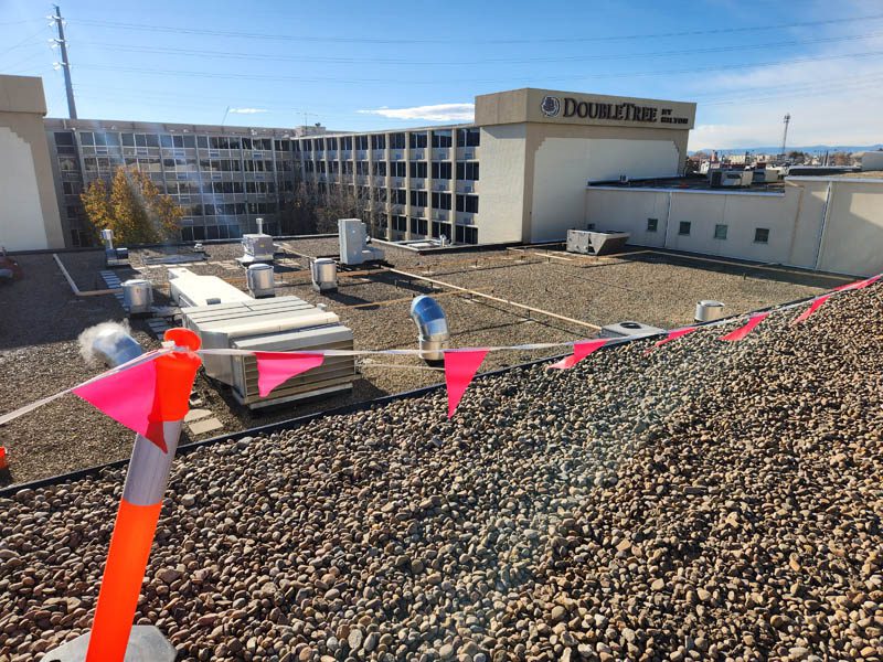 Northern Colorado commercial roofing contractor replacing flat roof on a hotel