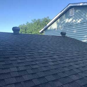 Roof replacement with black asphalt shingles by custom Exteriors
