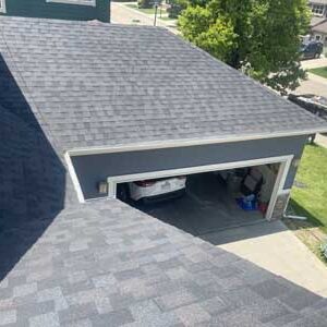 Asphalt shingles in grey roof replacement by Custom Exteriors