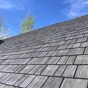Evergreen roofing company replacing a wood shake roof with synthetic shake shingles