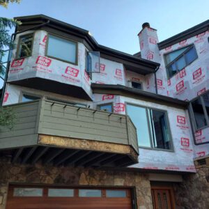 Pella window and siding replacement on condo association in Vail by Custom Exteriors