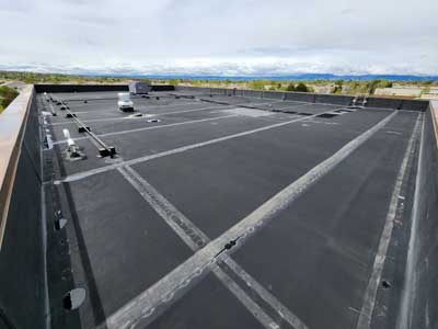 Maintenance on flat roof in Northern Colorado by Custom Exteriors