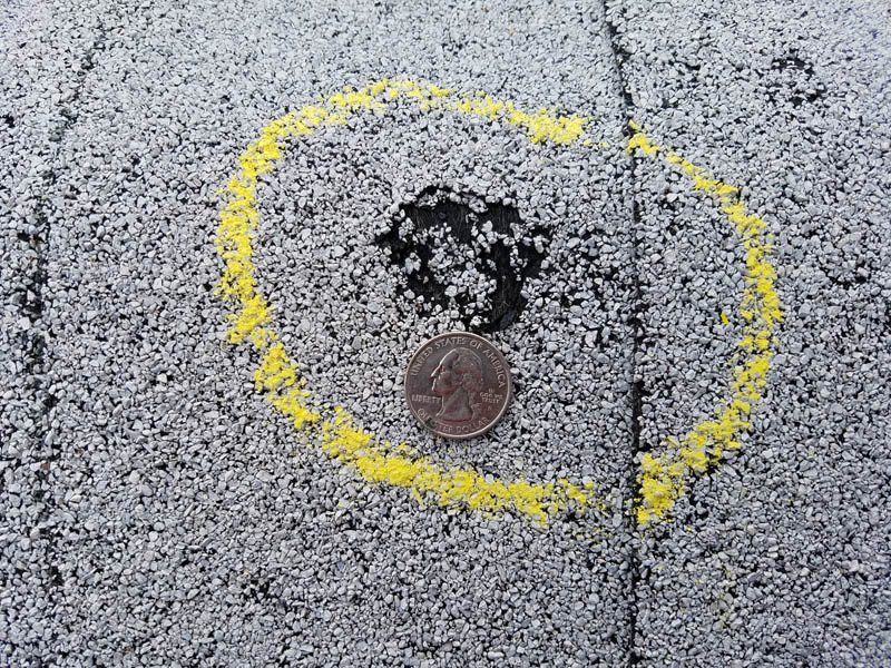 Hail damage on a roof discovered during a roofing inspection by Custom Exteriors