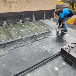 Commercial roofing contractors, Custom Exteriors, completing a large hospitality roof replacement in Denver Colorado