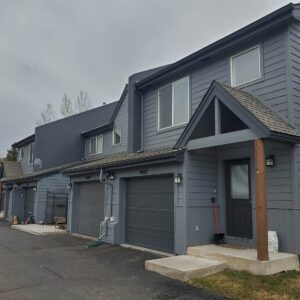 Exterior siding replacement on multi-family community by Custom Exteriors as part of exterior remodel including roof replacement