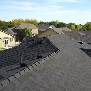 Black asphalt shingles, one of the many available styles and colors available when completing a Timnath roof replacement with Custom Exteriors