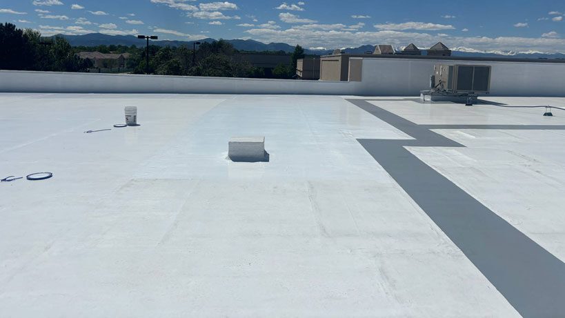 Commercial roof coating by Custom Exteriors on a Colorado business