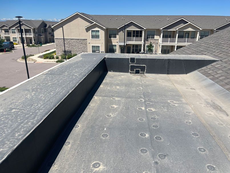 Multi-family roof inspection by Custom Exteriors, a Northern Colorado roofing company