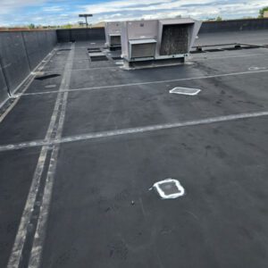 Commercial roof replacement by Cheyenne commercial roofing company, Custom Exteriors, flat roof