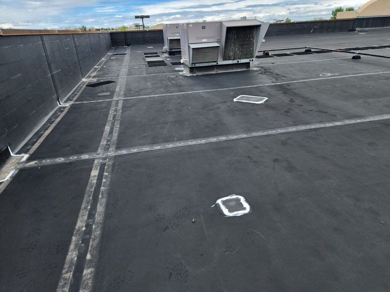 Commercial roof replacement by Cheyenne commercial roofing company, Custom Exteriors, flat roof