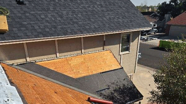 The roof installation process includes placing underlayment which is seen in this roof replacement picture from Custom Exteriors.