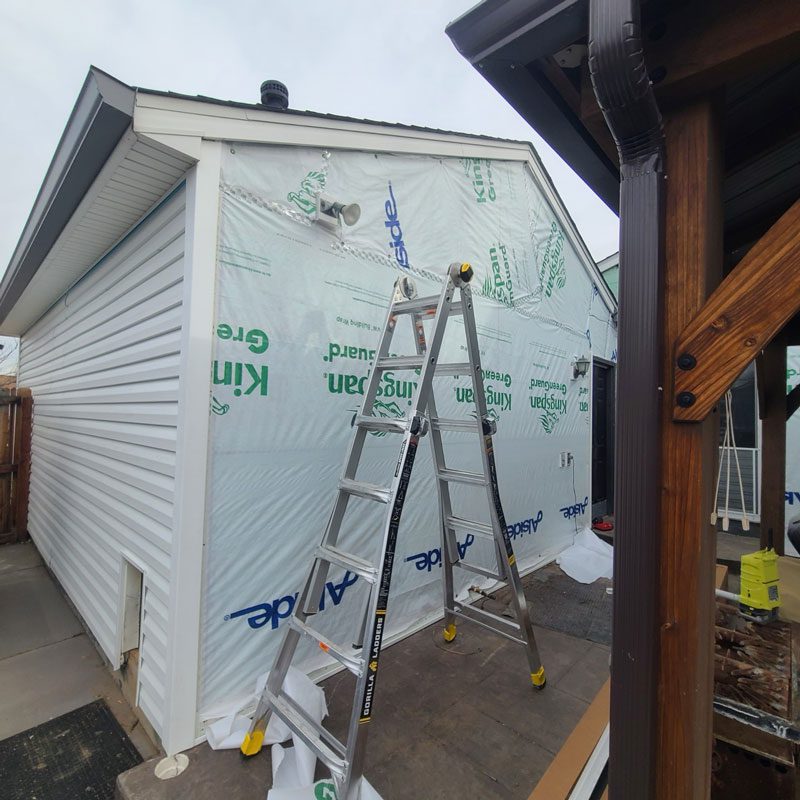 Boulder siding company, Custom Exteriors, replacing the siding on a Northern Colorado home