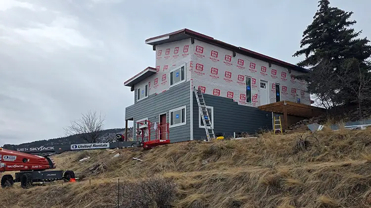 Photo taken during a James Hardie Color Plus siding installation by Custom Exteriors in West Fort Collins.