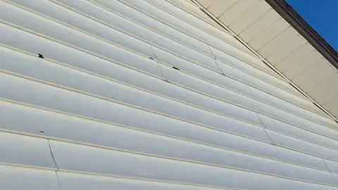 ios_vl5o8t_a4i9fq copy - Custom Exteriors, LLC Extensive damage to the existing vinyl siding.