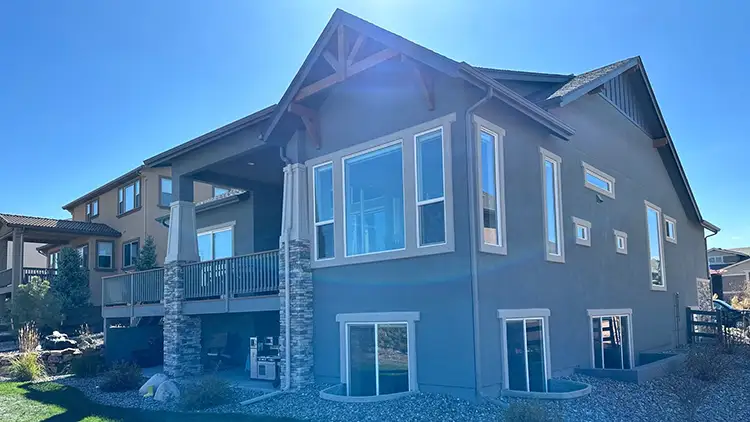 Windows on a Colorado Springs home during an exterior inspection by Custom Exteriors.