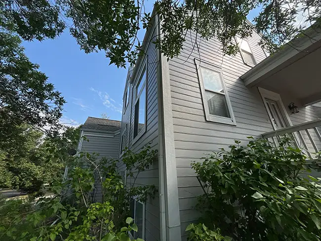 Windows on a Longmont home during an inspection by Custom Exteriors.