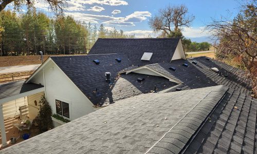 Asphalt roof replacement by Custom Exteriors, a Greeley roofing contractor