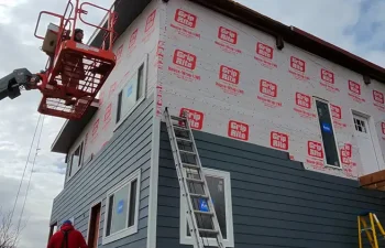 The siding team at Custom Exteriors installing James Hardie siding on a Northern Colorado home.