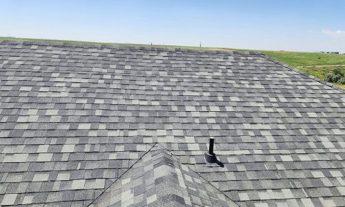 Asphalt shingle roof replacement by Custom Exteriors, a Northern Colorado roofing and exteriors company